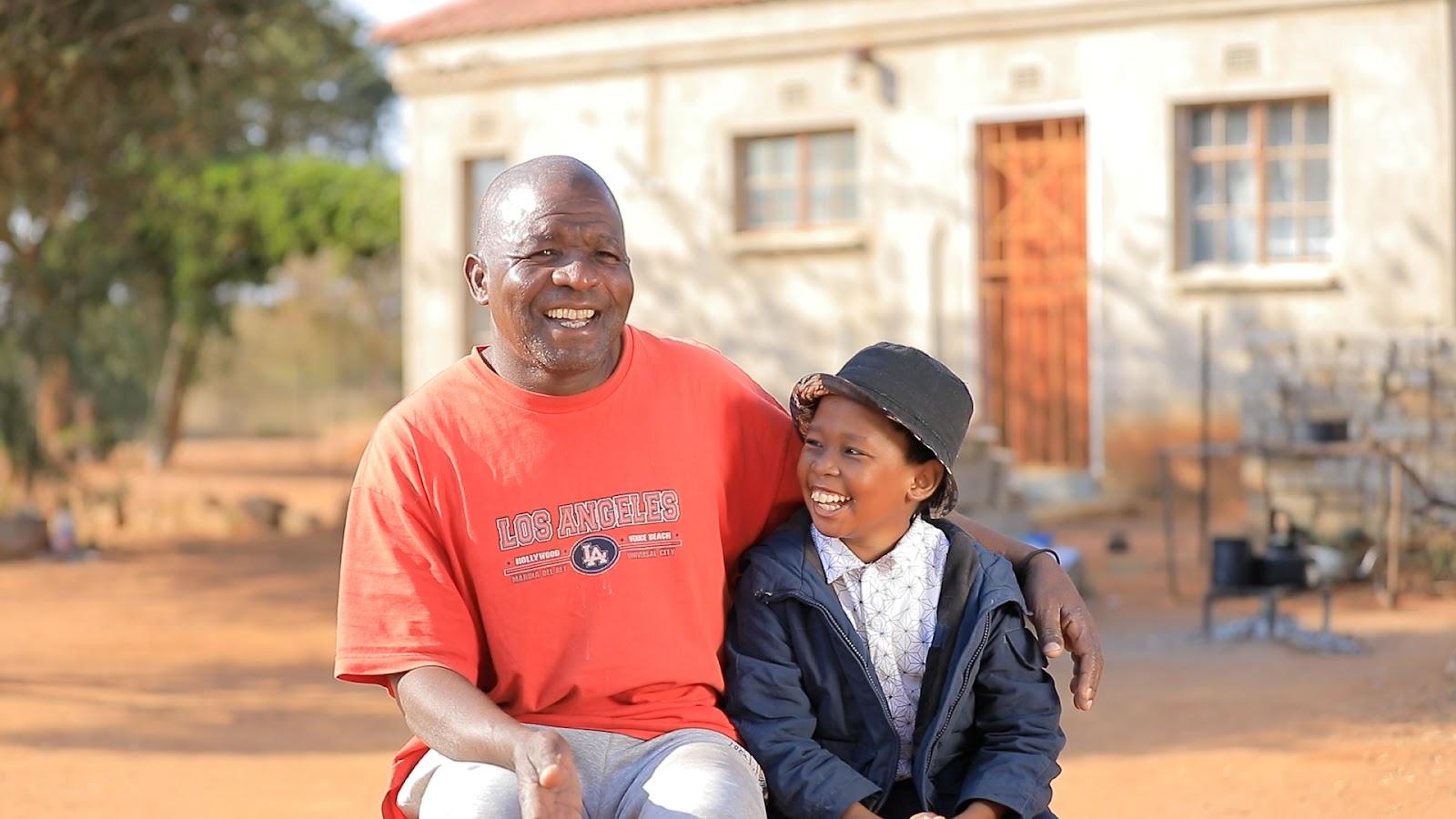 Man and boy in Botswana Man and boy in Botswana