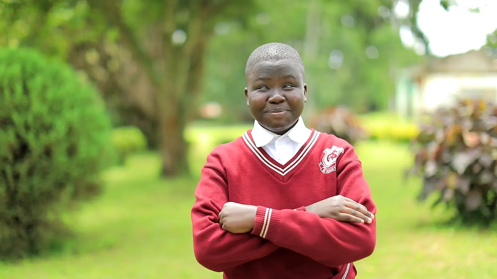 Boy with arms crossed and broad smile Boy with arms crossed and broad smile